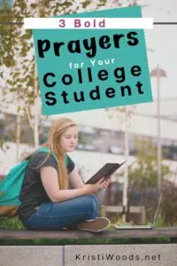 Female college student looking at a book