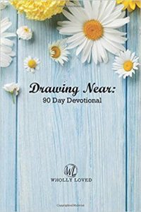 book cover for Drawing Near: 90 Day Devotional with blue wooden background with daisies at the top