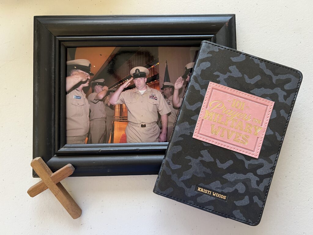 book cover of 101 prayers for military wives along with cross and picture of sailors saluting