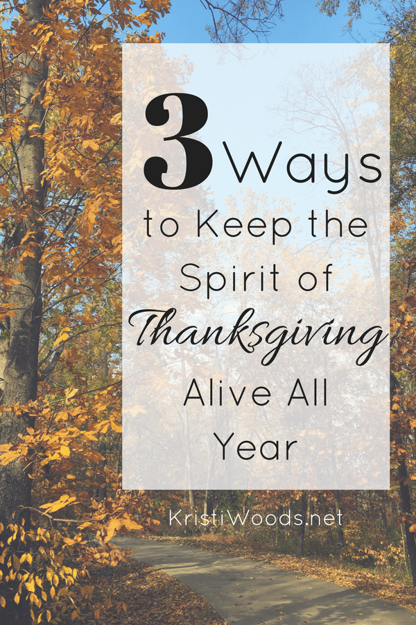 Fall leaves on trees with post title overlay with 3 Ways to Keep the Spirit of Thanksgiving Alive All Year