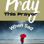 person walking with umbrella on rainy day, blog post title overhead for Pray This Prayer When Sad