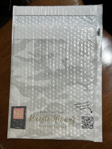 Gray camoflauge Customized Bubble mailer that say Book Mail from Kristi Woods on it